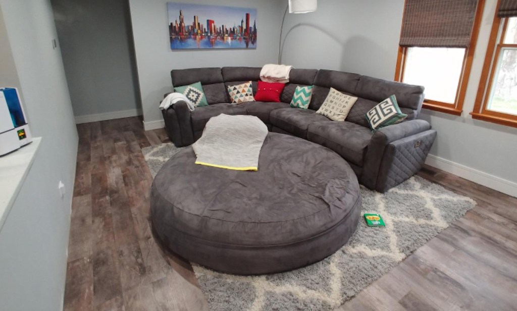 gray sectional and bean bag ottoman in living room
