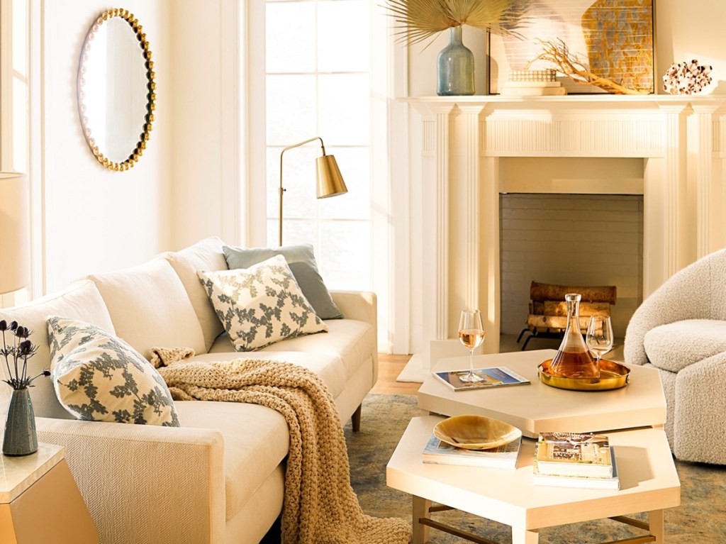 living room with cream colored furniture