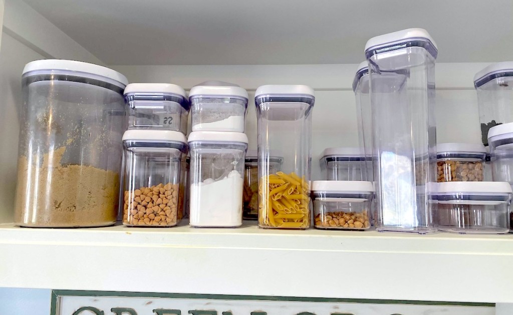 rows of clear oxo food storage containers on shelf