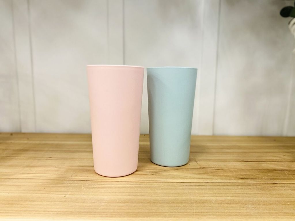 pink and gray plastic tumblers