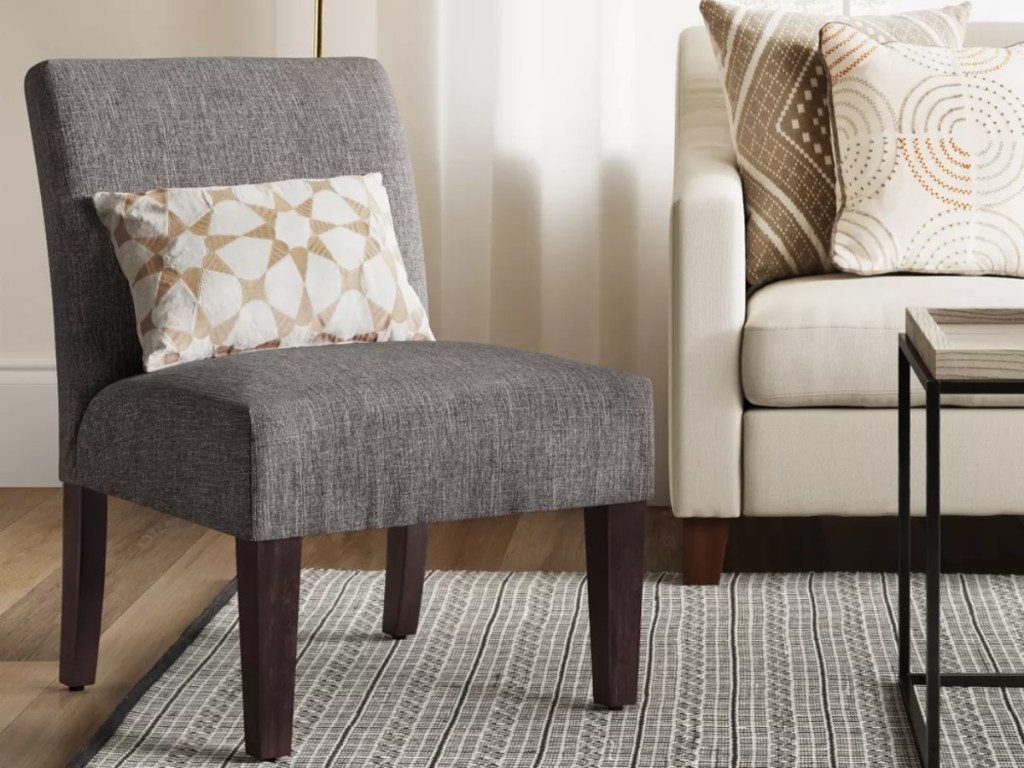 gray chair with accent pillow