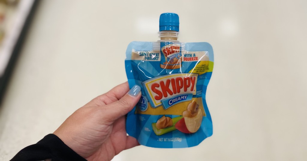 skippy squeeze pouch in hand in store