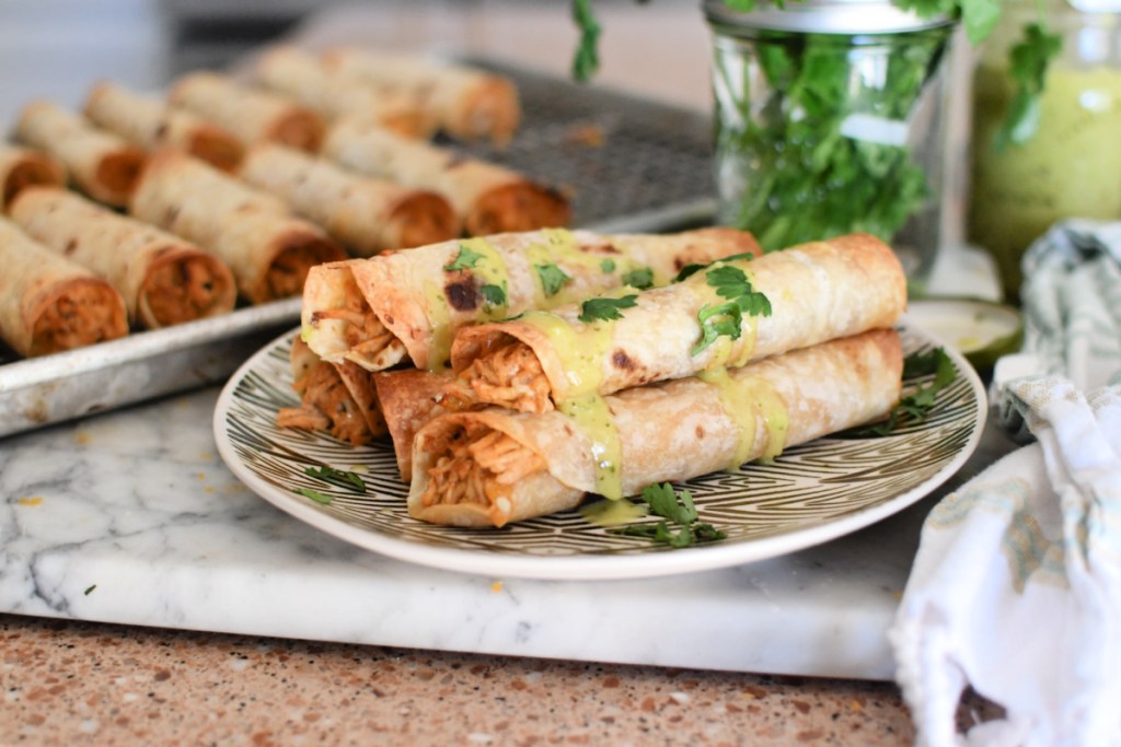slow cooker chicken taquitos with salsa on top