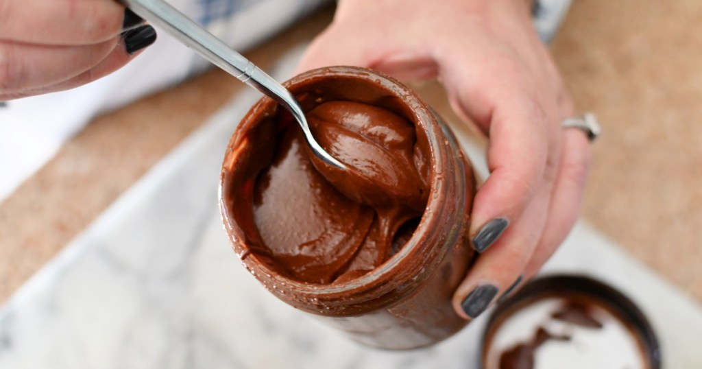 spoonful of homemade nutella in a jar