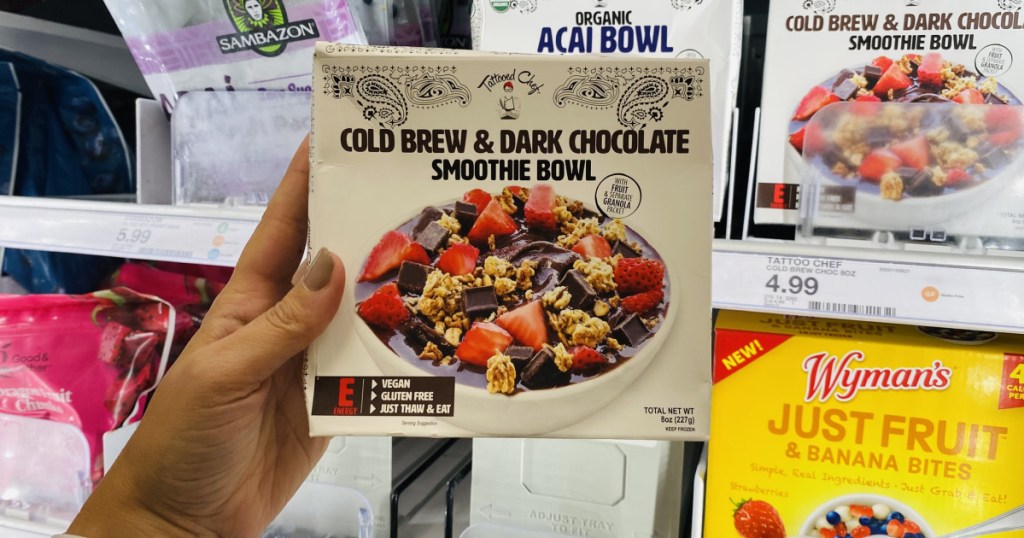 tattooed chef smoothie bowl in hand in store at target