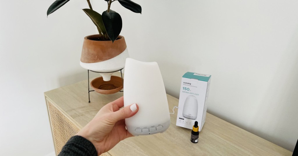 woman holding a diffuser