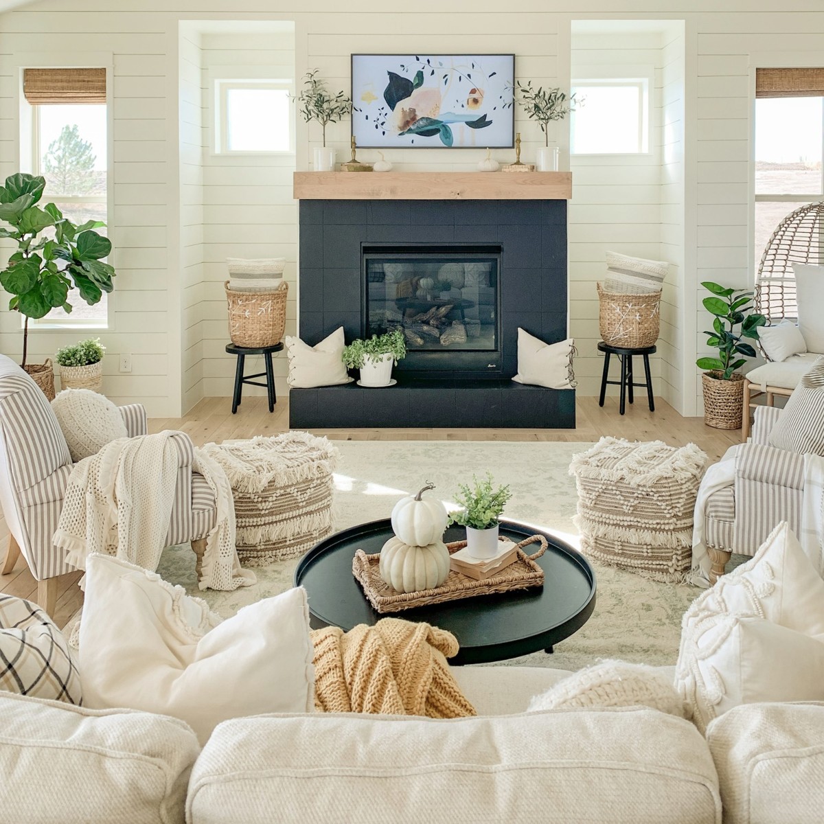 living room with navy fireplace and neutral President's Day furniture sale items