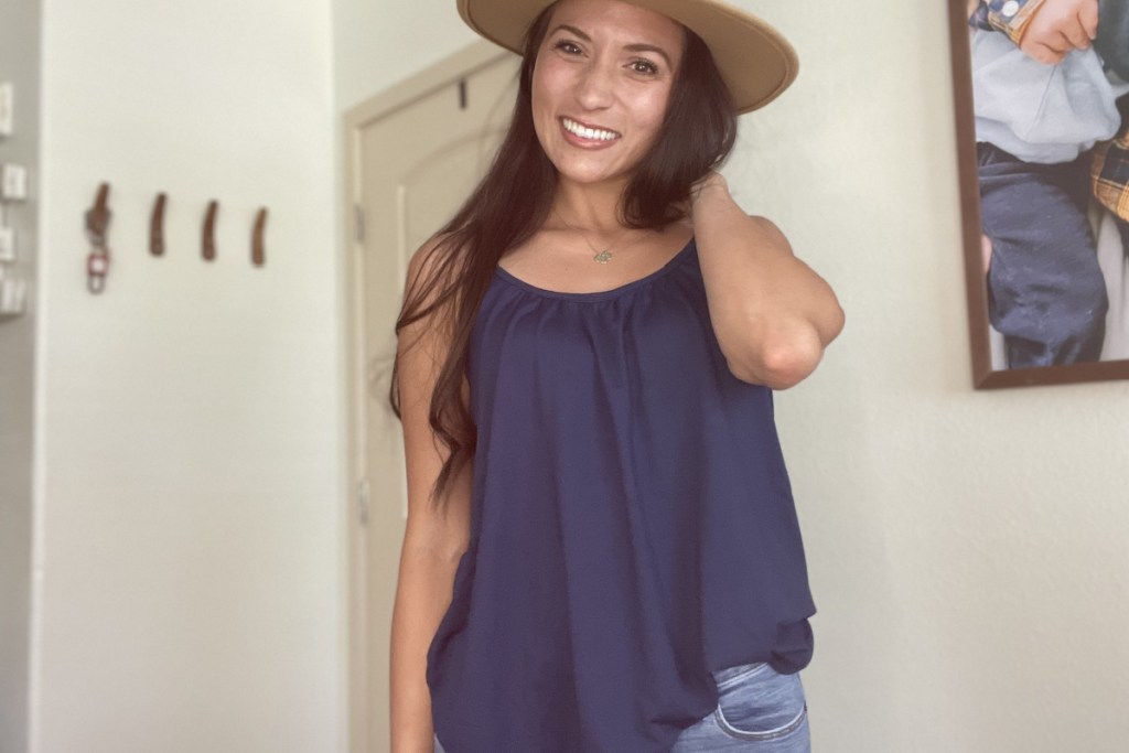 woman wearing 32 degrees blue cami with hat on