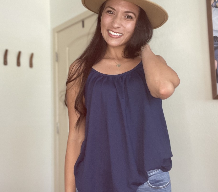 woman wearing 32 degrees blue cami with hat on