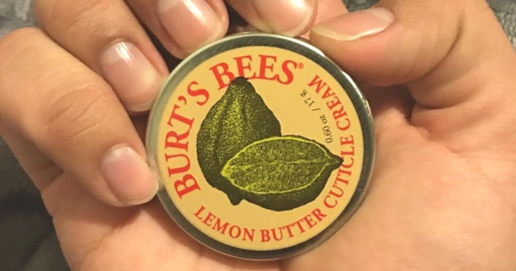 hand holding Burt's Bees Lemon Butter Cuticle Cream