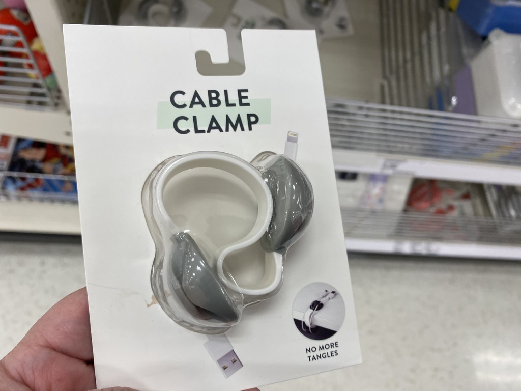 Hand holding up a Cable Clamp