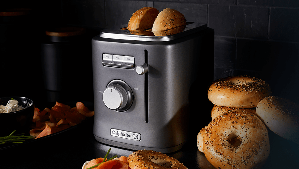 toaster with bagels in it and around it