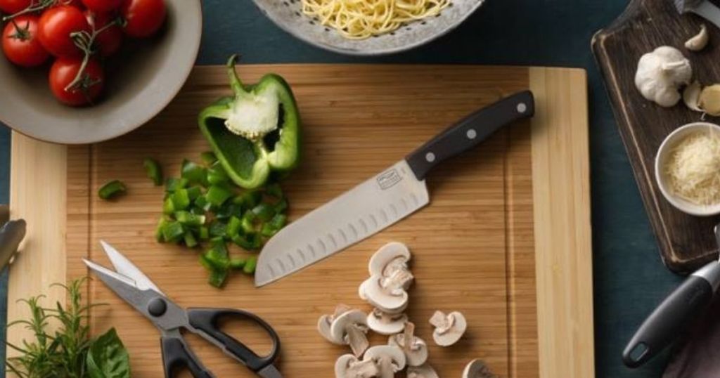Chicago Cutlery Knife on cutting board with food