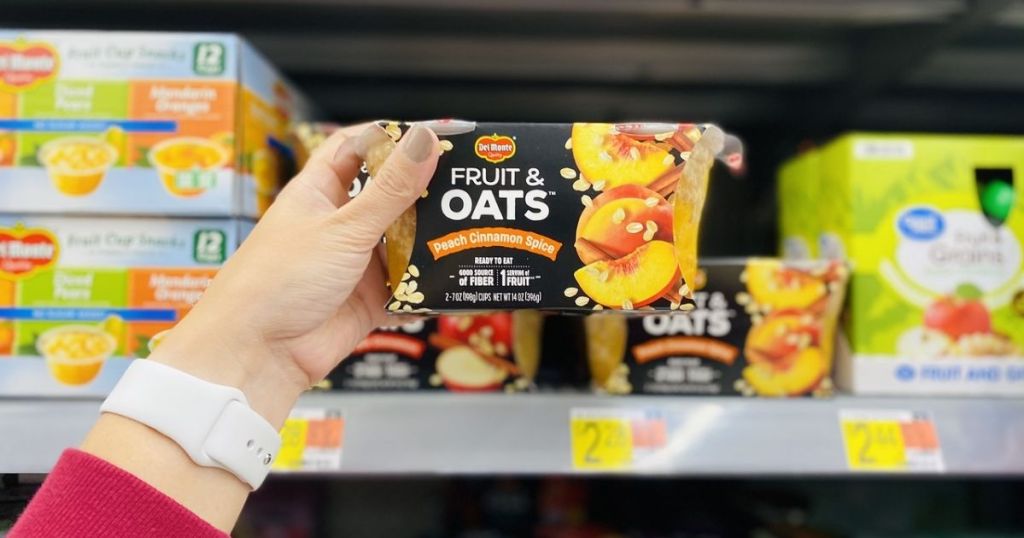 hand holding Del Monte Fruit & Oats Snack in store
