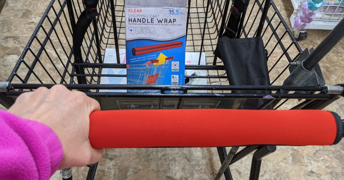 hand holding a cart handle covered in a wrap from dollar tree