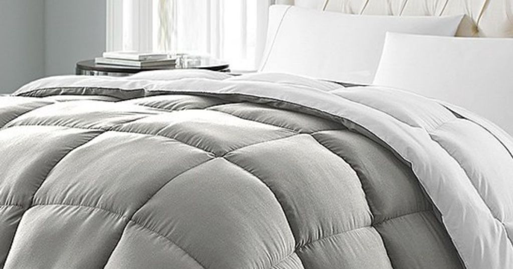 gray and white Down Alternative Comforter on bed