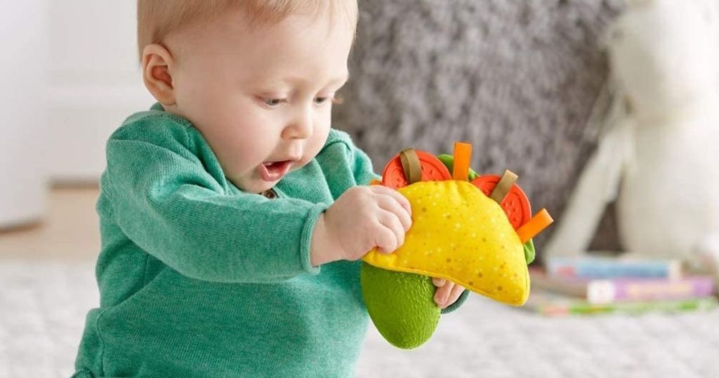 baby playing with Fisher-Price Taco Tuesday Gift Set