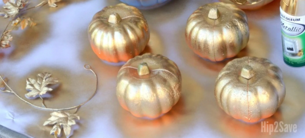 Dollar tree wedding ideas include spray painting gold pumpkins to place on your tables