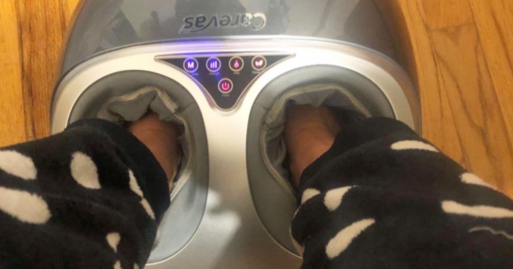 person with feet inside massager