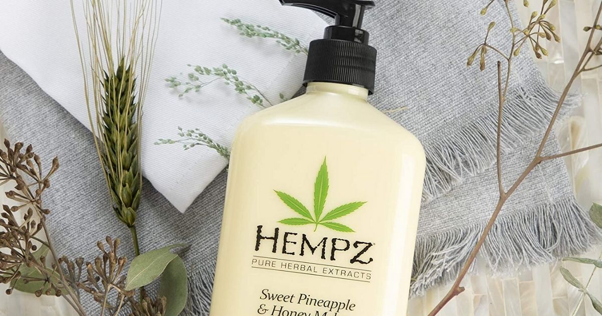 Hempz Lotion bottle with herbs in background