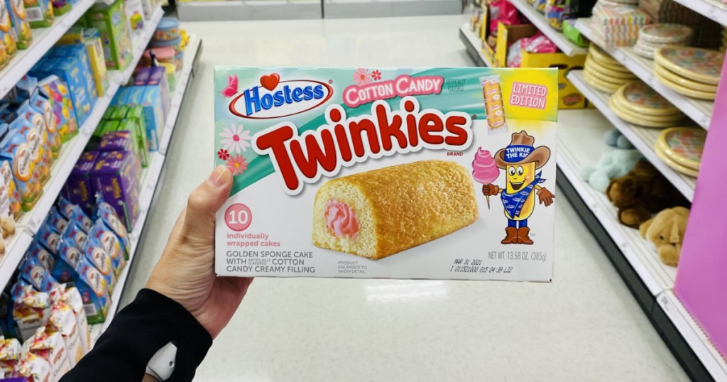 woman holding a box of Hostess Cotton Candy Twinkies