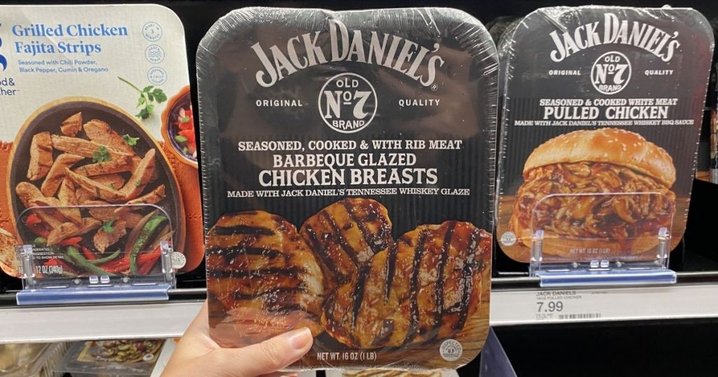 hand holding a pack of Jack Daniel's Chicken Breasts