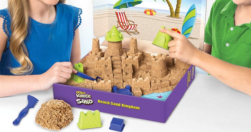 kids playing with Kinetic Sand Castle
