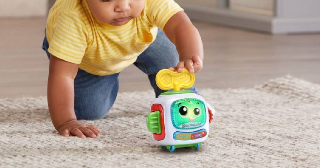 Baby playing with LeapFrog Bot Toy
