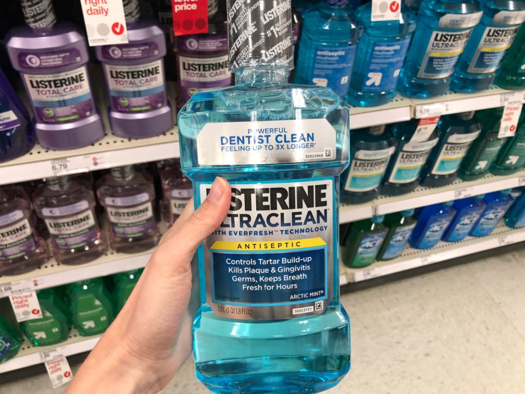 Listerine Ultraclean 1-Liter Arctic Mist Mouthwash in hand