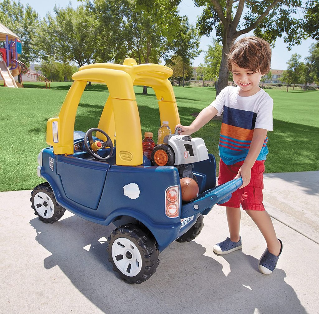 boy loading up back of Little Tikes Cozy Truck