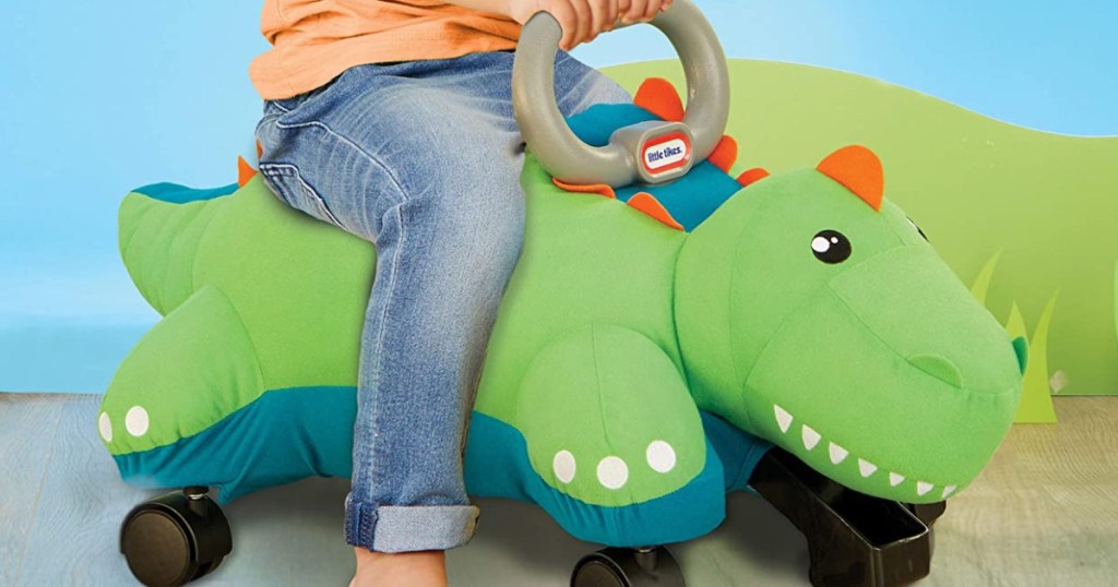 boy riding Little Tikes Dino Racer