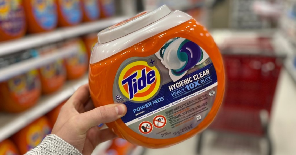 Man's Hand Holding Tide Pods