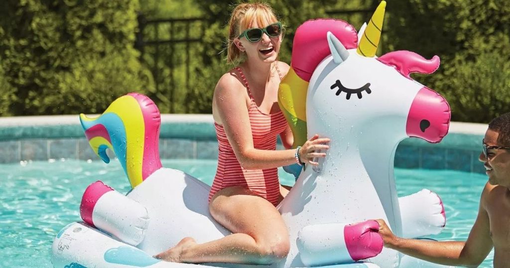 woman on a unicorn pool float