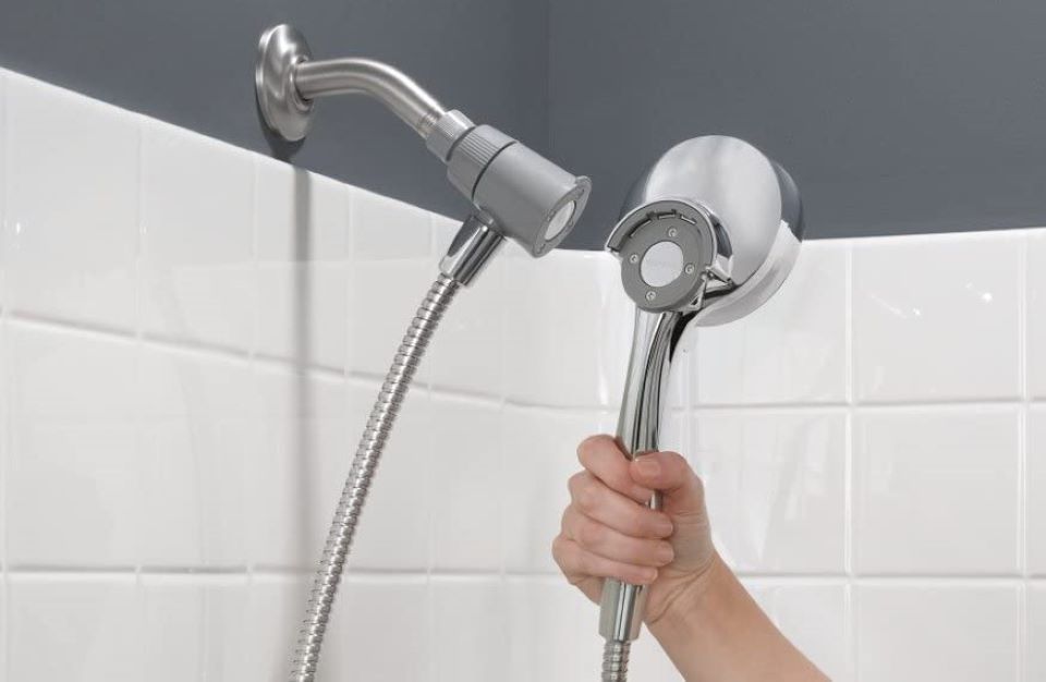 hand holding a showerhead