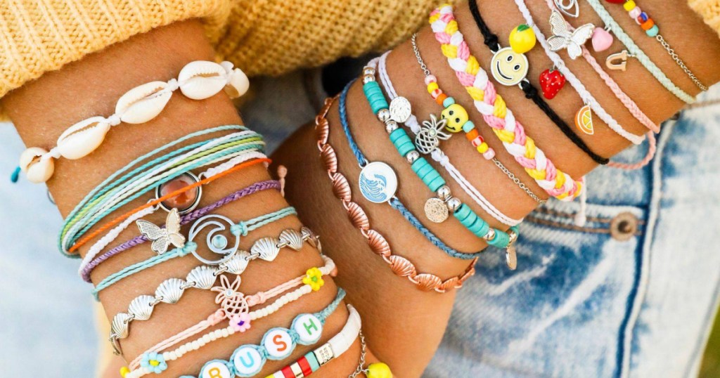 woman wearing multiple colored bracelets