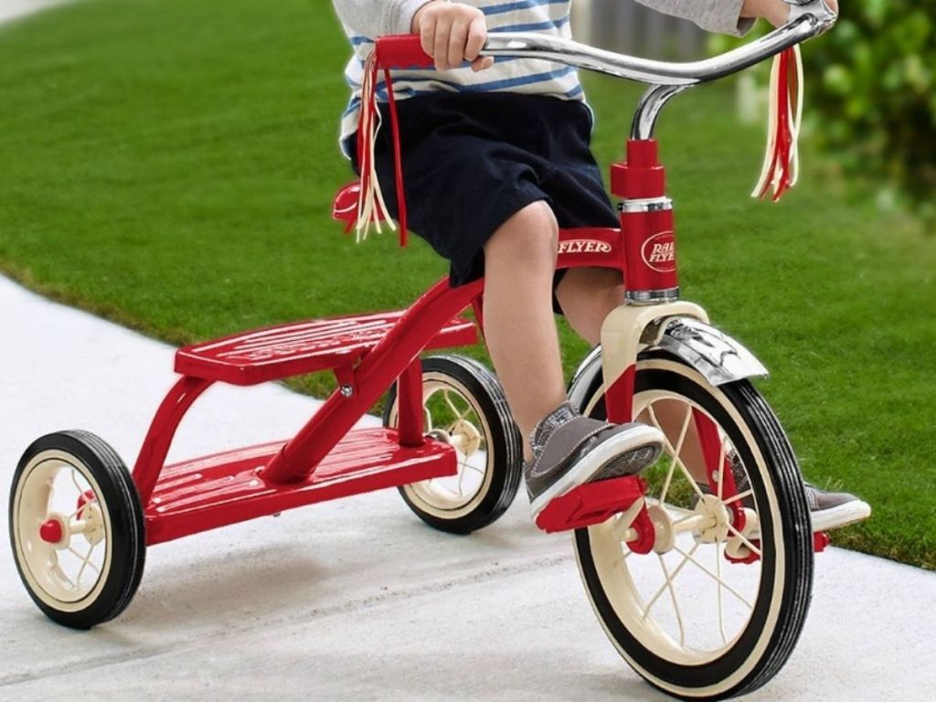 Little boy on Radio Flyer Red Tricycle