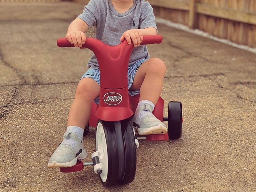Little boy on Radio Flyer Scoot to Pedal