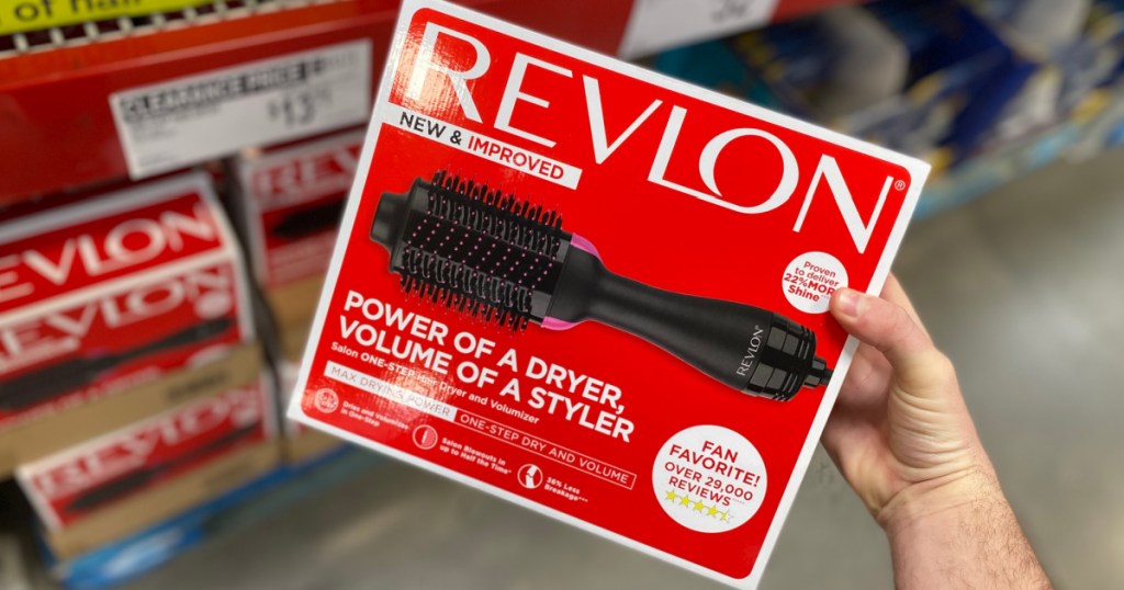 Revlon hair volumizer in hand near in-store display