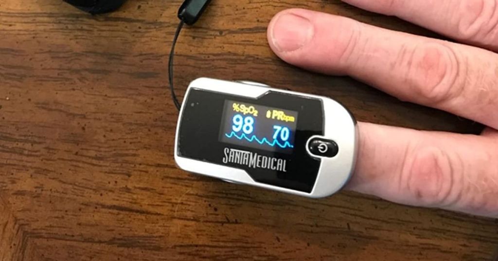 finger with a pulse oximeter on it
