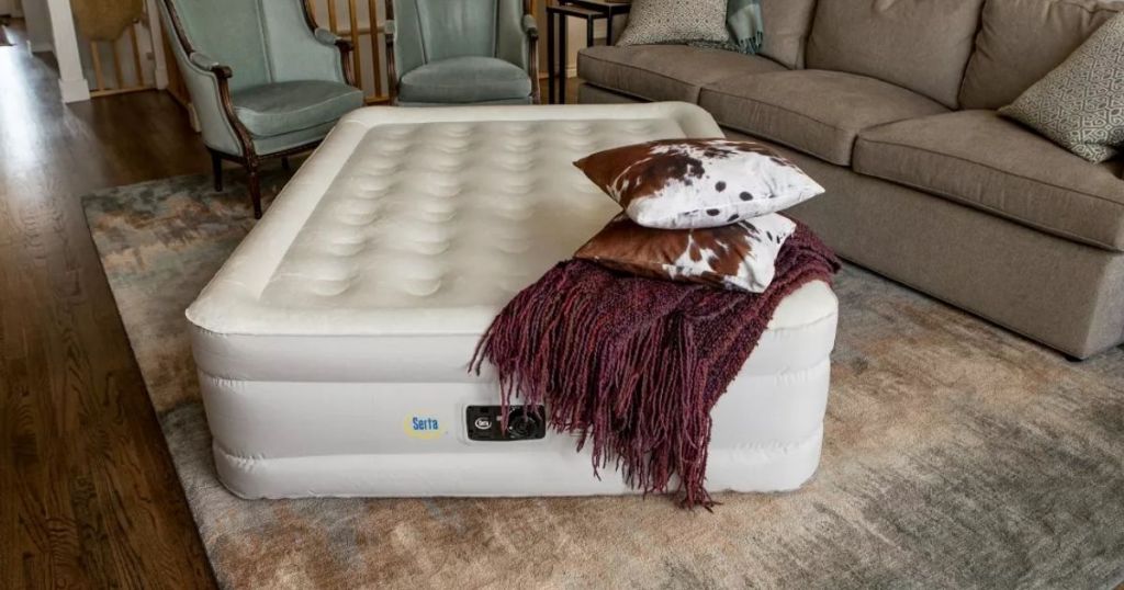Serta Raised Air Mattress in a room with blanket and pillows