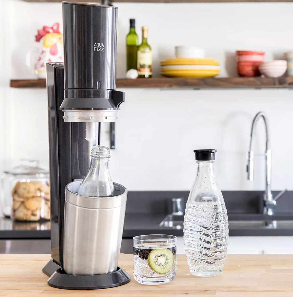 sodastream machine on counter with glass carafes