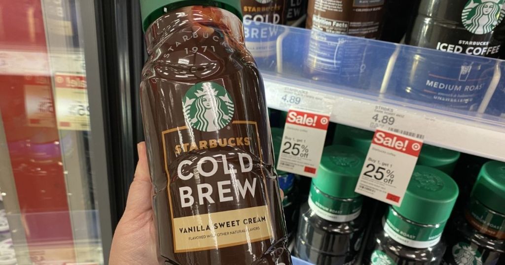 hand holding a Starbucks Cold Brew bottle
