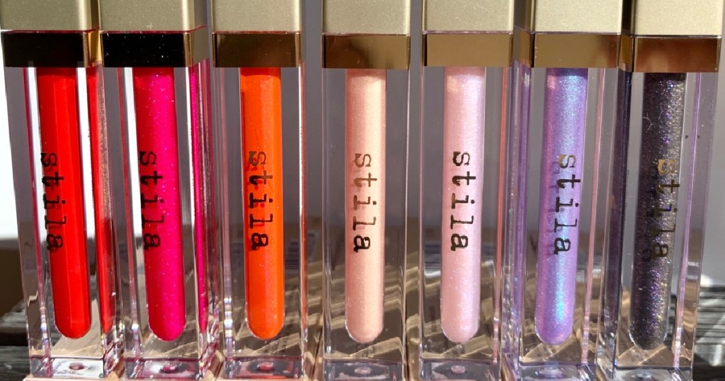 row of standing lip glosses in different shades