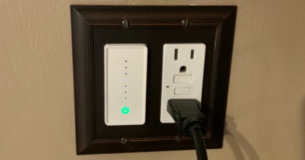 smart light switch dimmer and outlet with cored plugged into wall