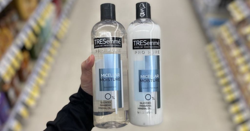 hand holding TRESemmé Shampoo and Conditioner in store