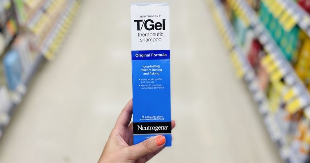 hand holding T/Gel therapeutic shampoo in store