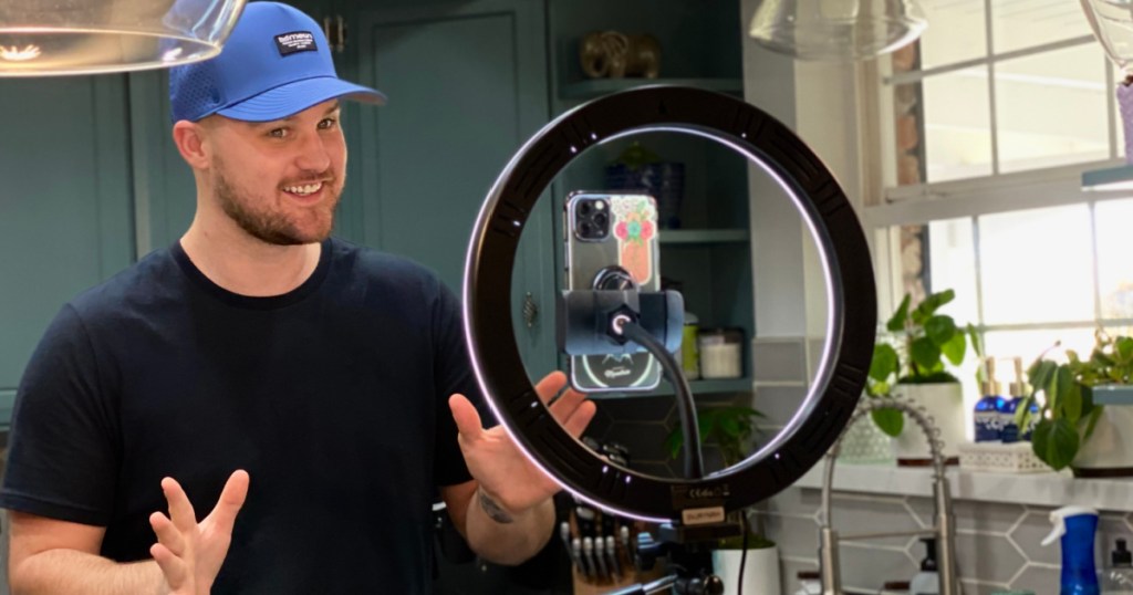 Man using a ring light in a kitchen