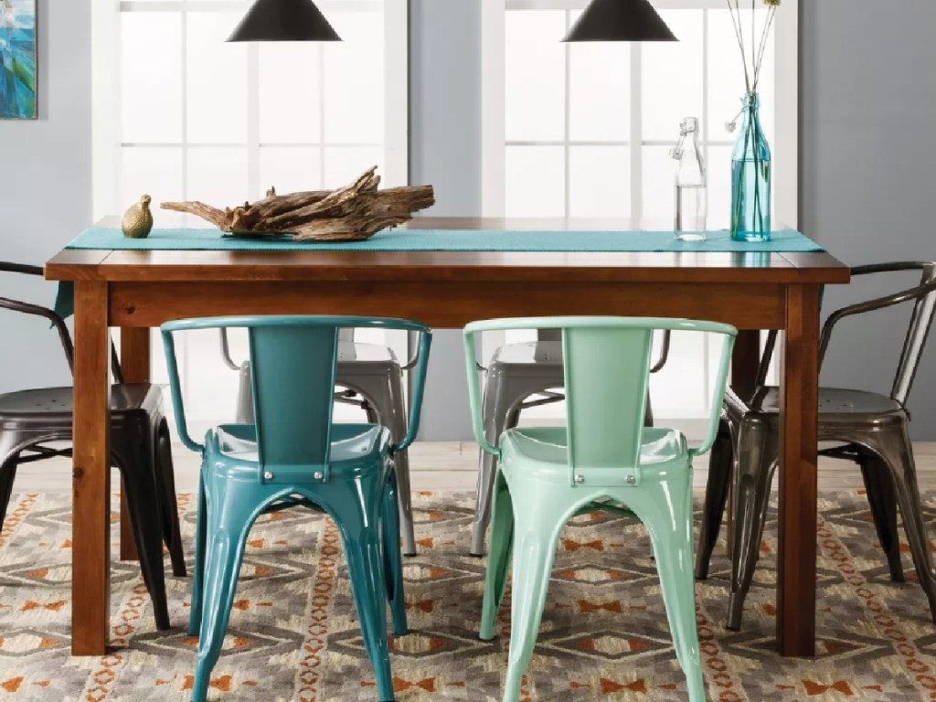 kitchen table surrounded by chairs