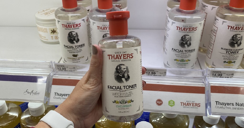 hand holding up a bottle of Thayers Facial Toner