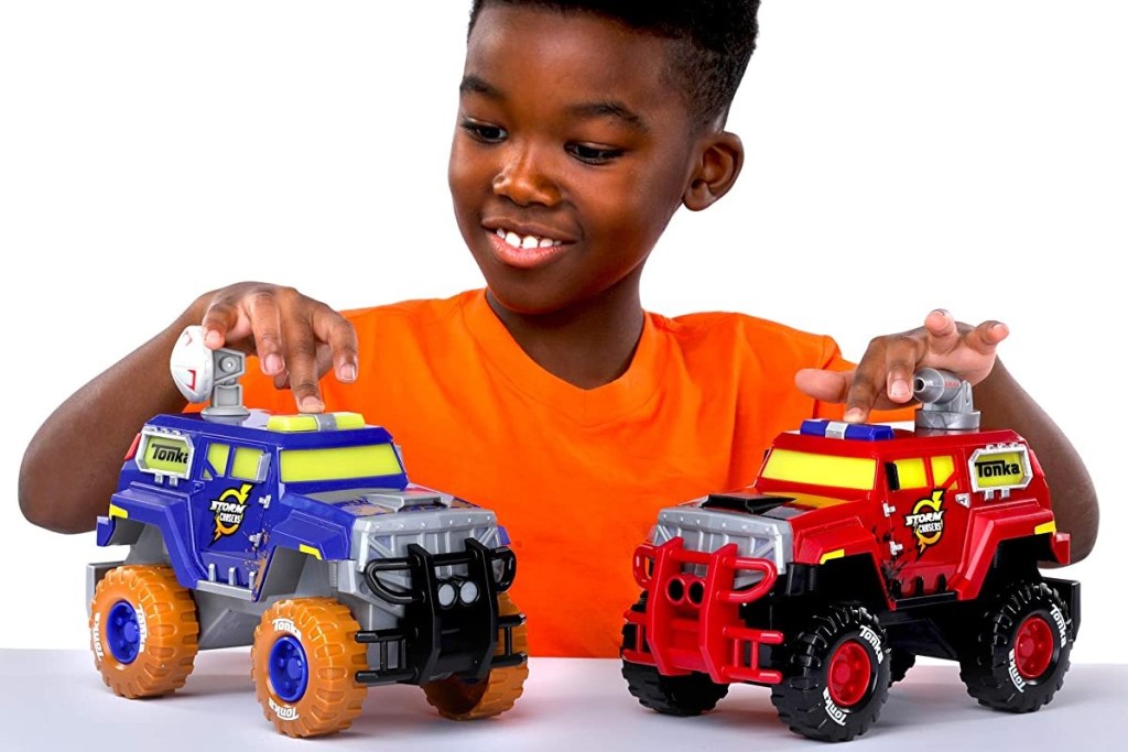 boy playing with Tonka trucks